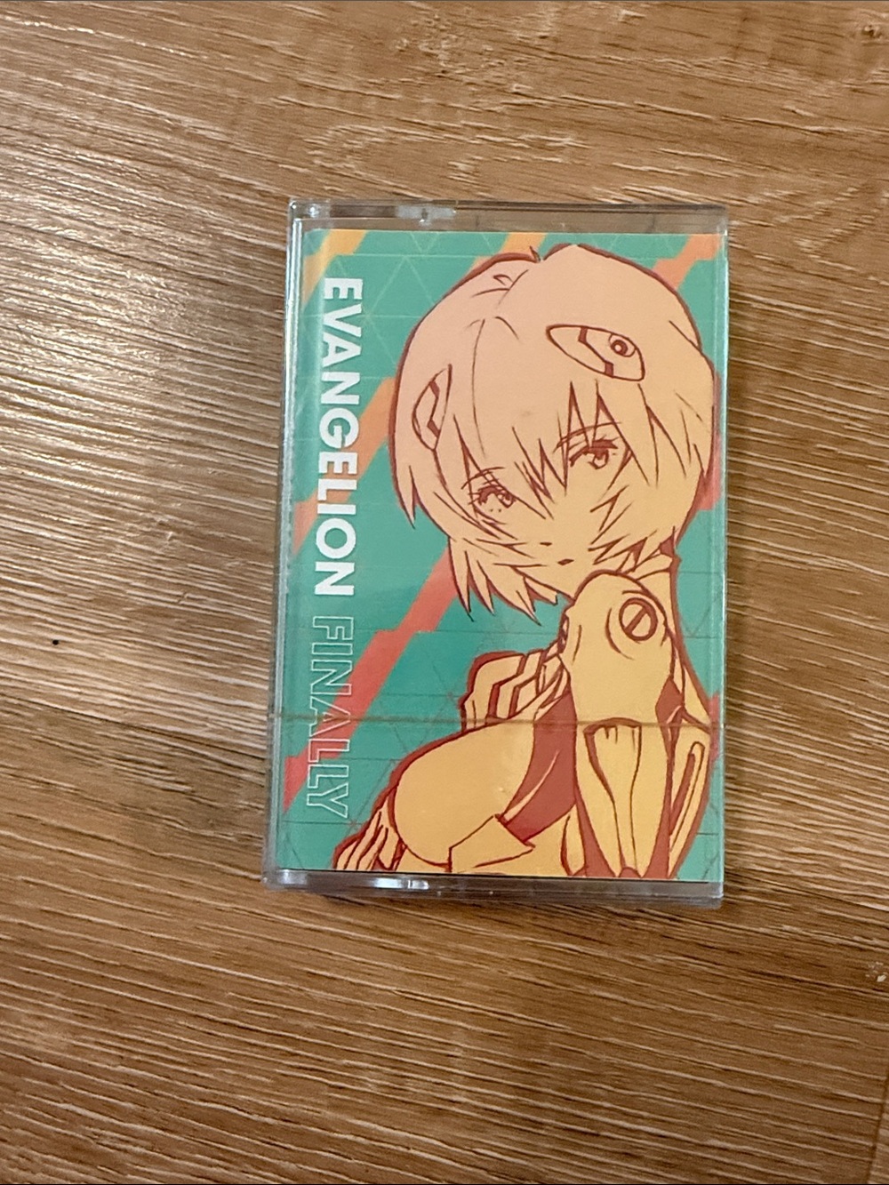 Evangelion Cassette Tape Case with Anime Artwork - Teal & Peach